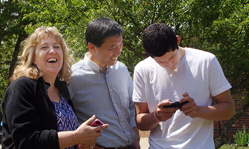 Three students outdoors